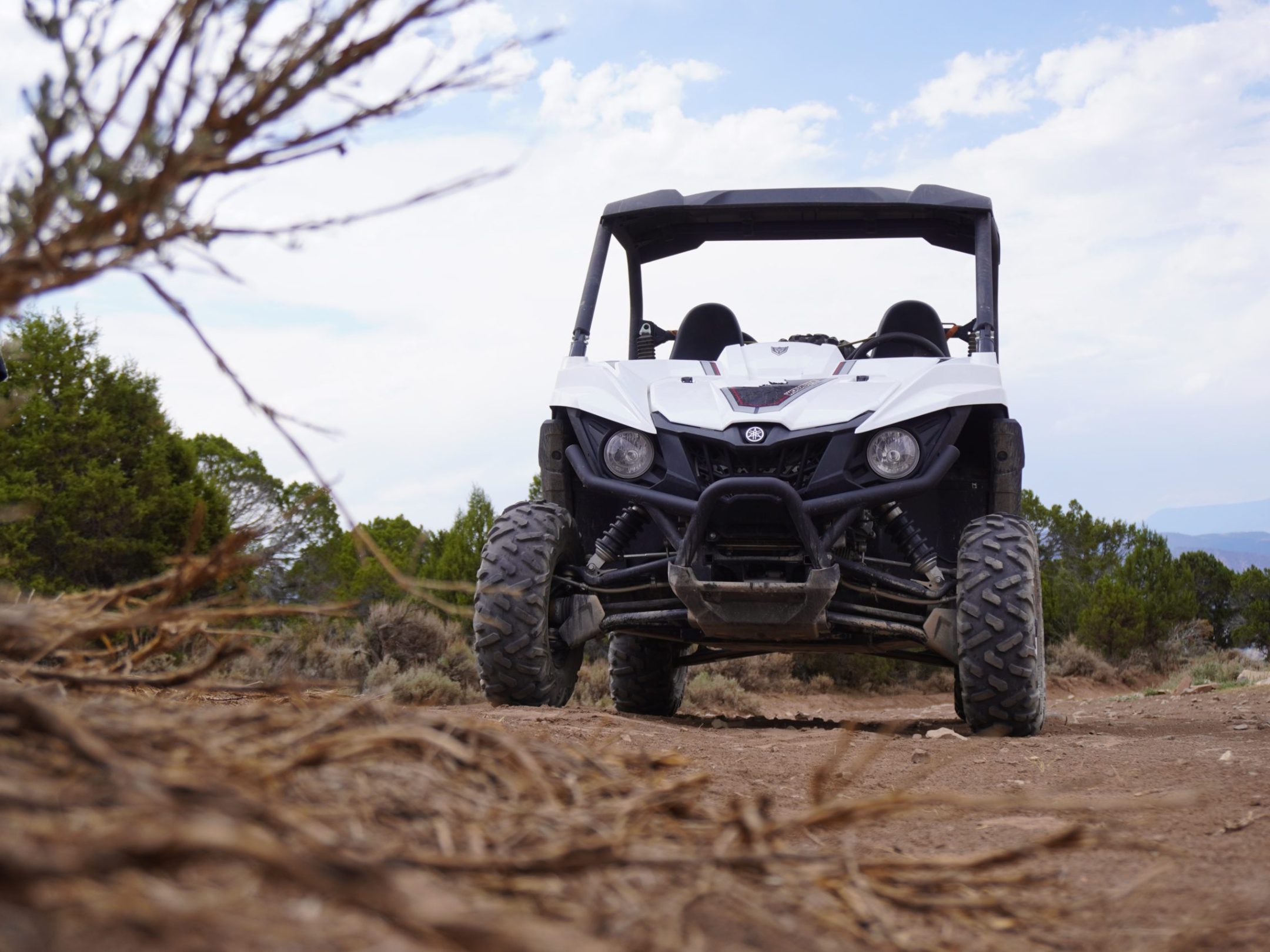 a truck driving down a dirt road